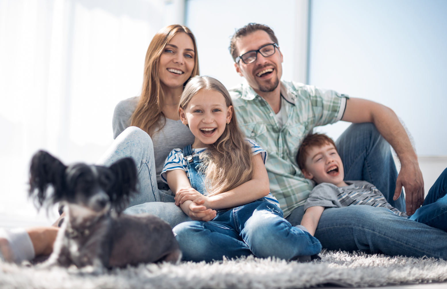 background image of happy family with pet